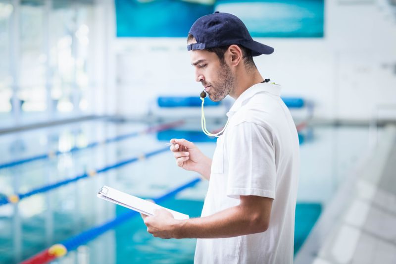 swimming coach with whistle