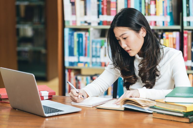 college student studying library